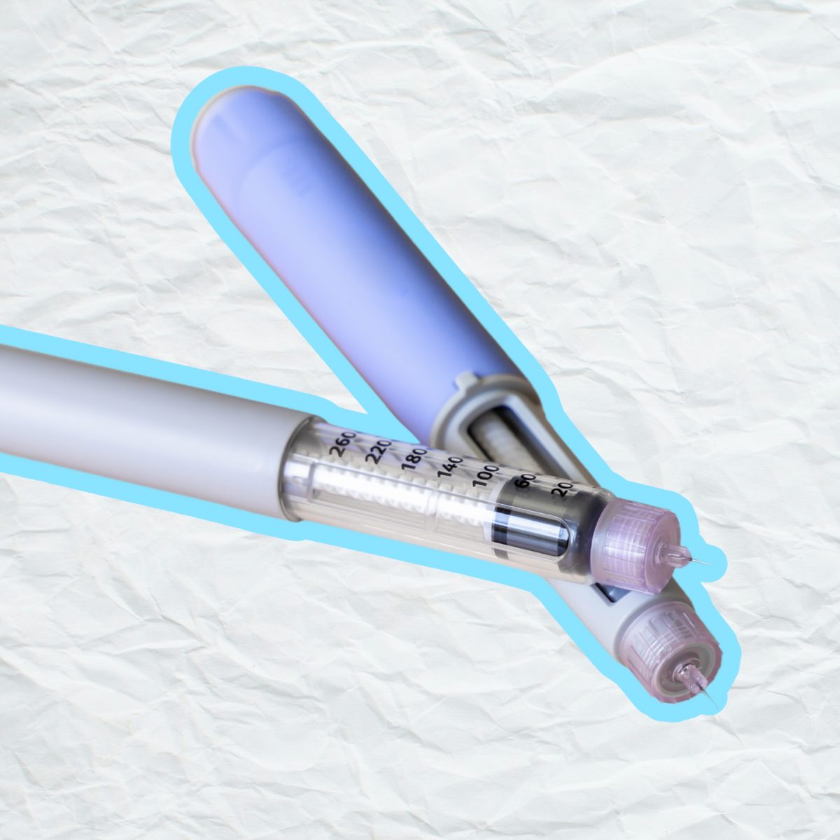 A graphic of two weight loss injectable medication pens placed on a textured, crumpled-paper background. The pens have clear barrels with visible dosage markings and capped needle tips. A light blue outline surrounds the pens, giving the image a stylized appearance.