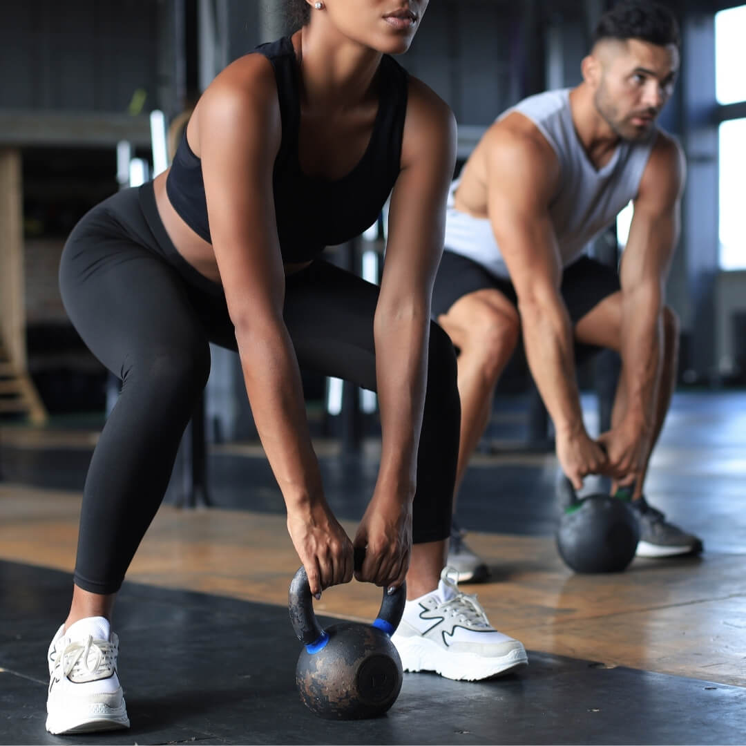 Plus sized woman in underwear measuring waist.
