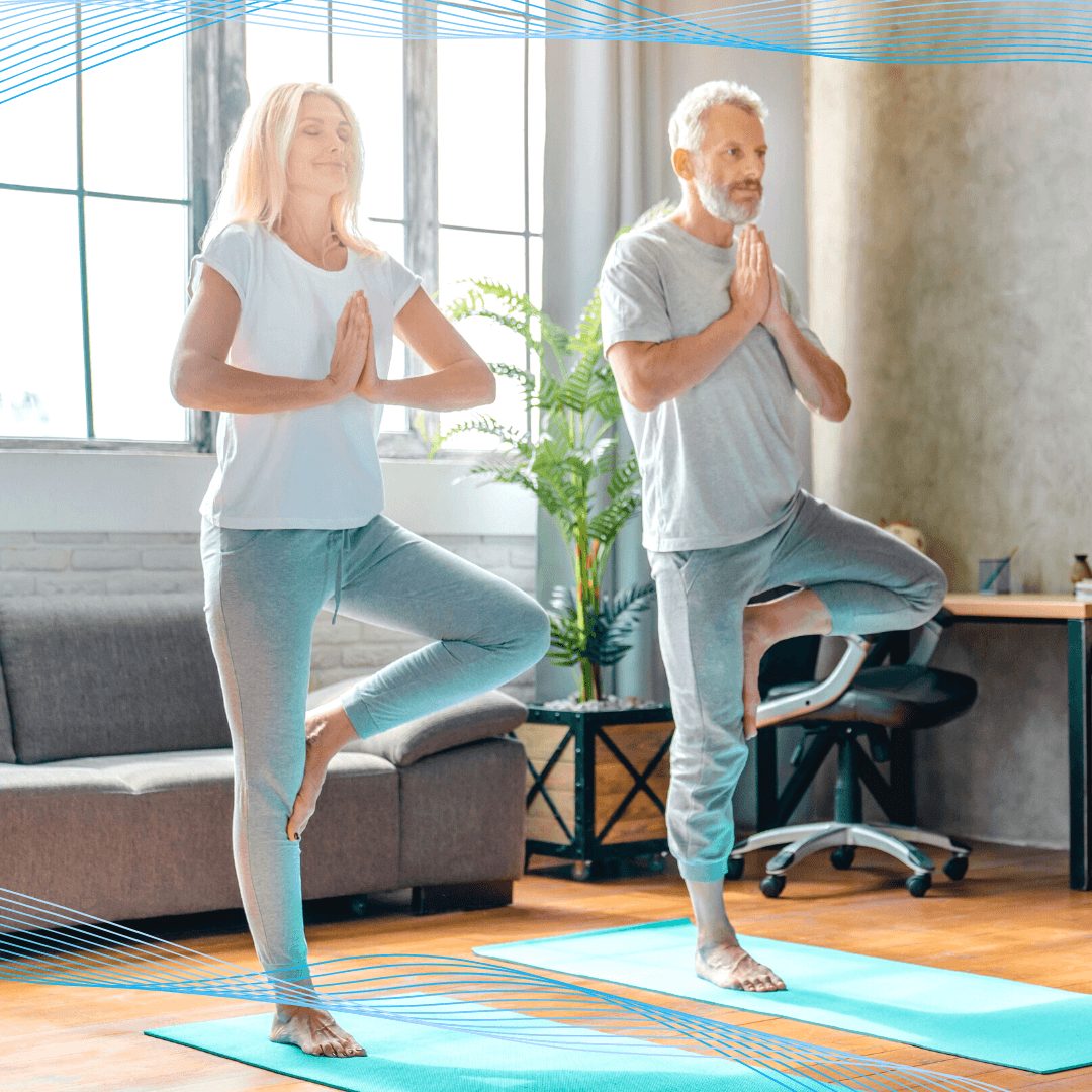 Man and woman doing yoga poses.