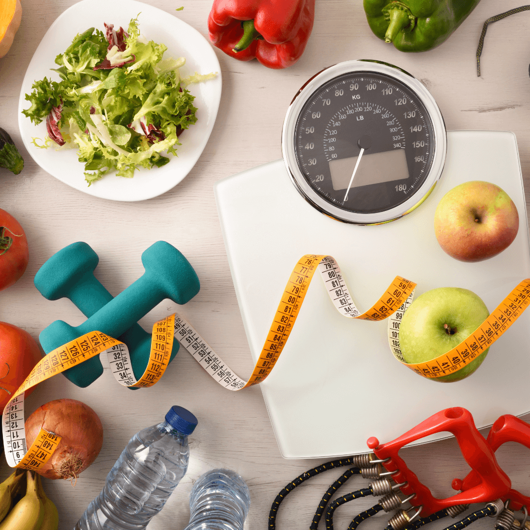 exercise equipment and healthy food scattered on a table to show nutrition for exercise