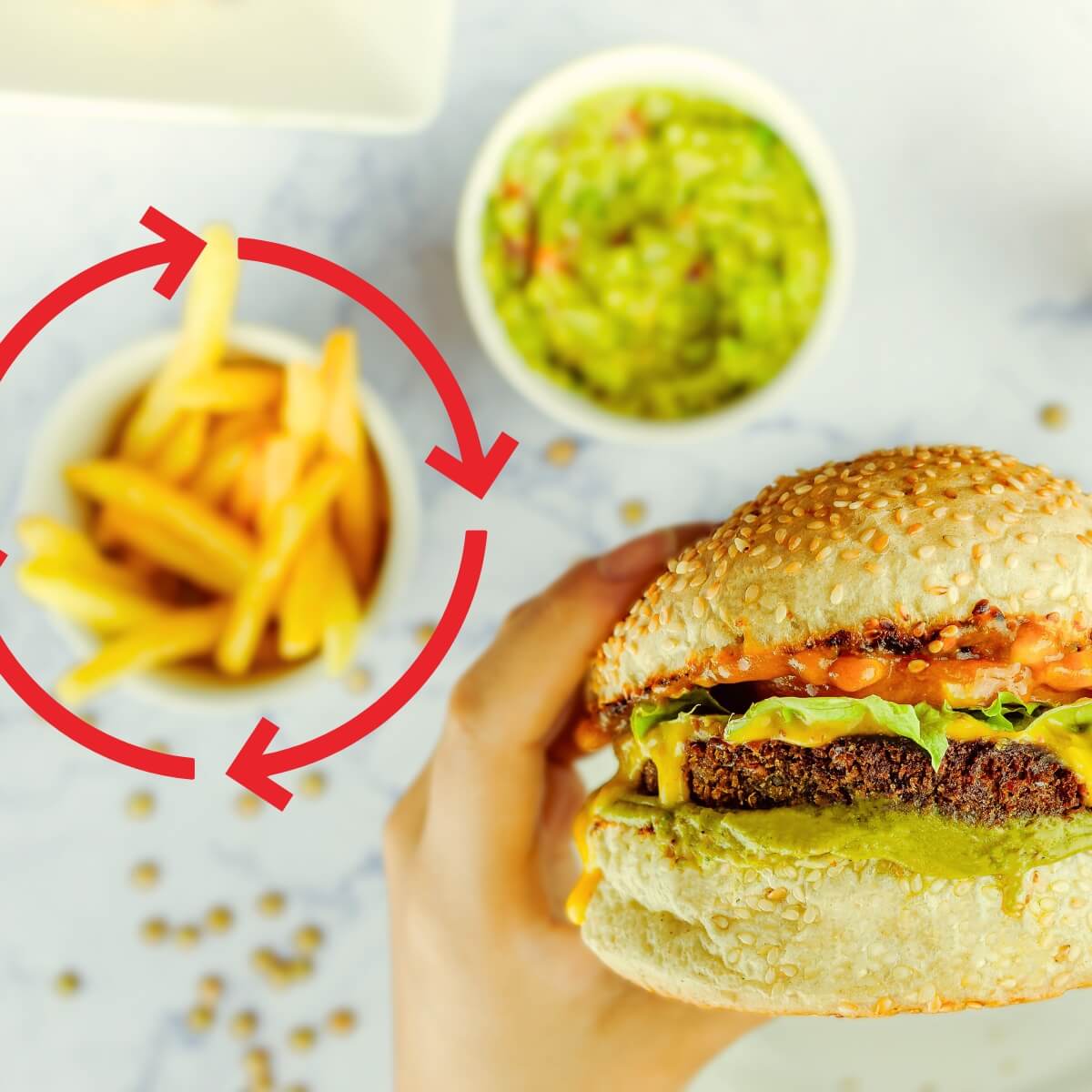 Picture of hamburger with fries and guacamole.