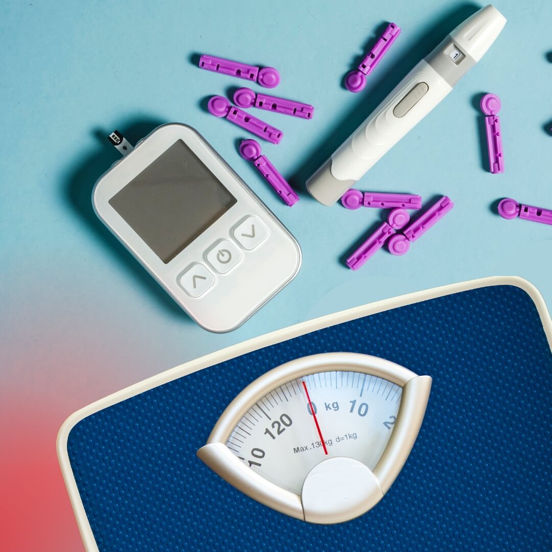 Scale next to tools for monitoring diabetes.